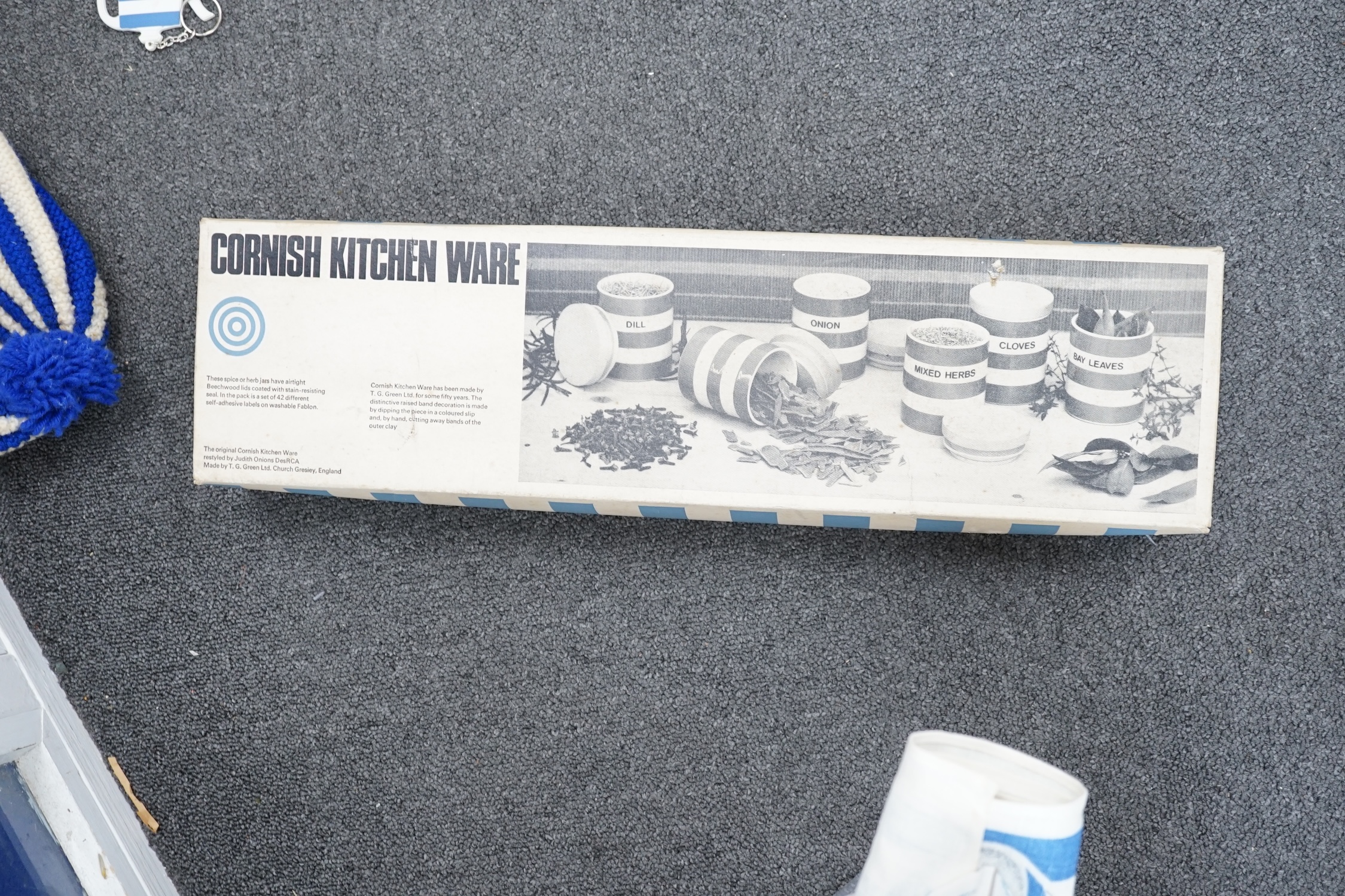 T.G.Green Cornish Kitchenware, a set of five modern boxed storage jars, a modern boxed child's tea set, assorted tea towels, oven gloves, merchandise, etc. Condition - good